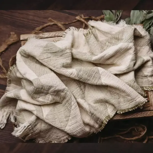 Green fringed newborn photography blanket with soft textured weave