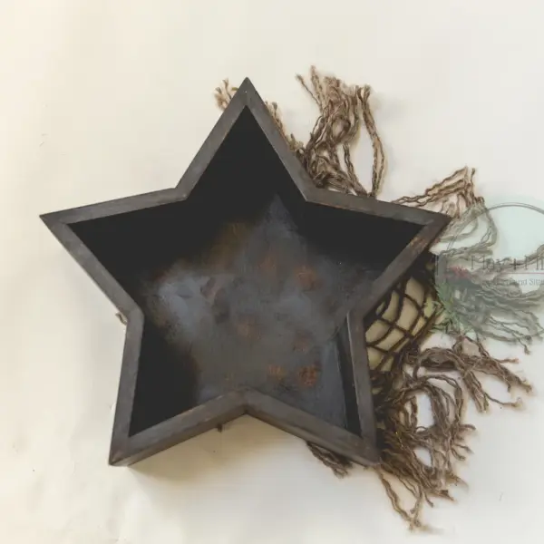 Shooting star newborn photography posing bowl in natural wood