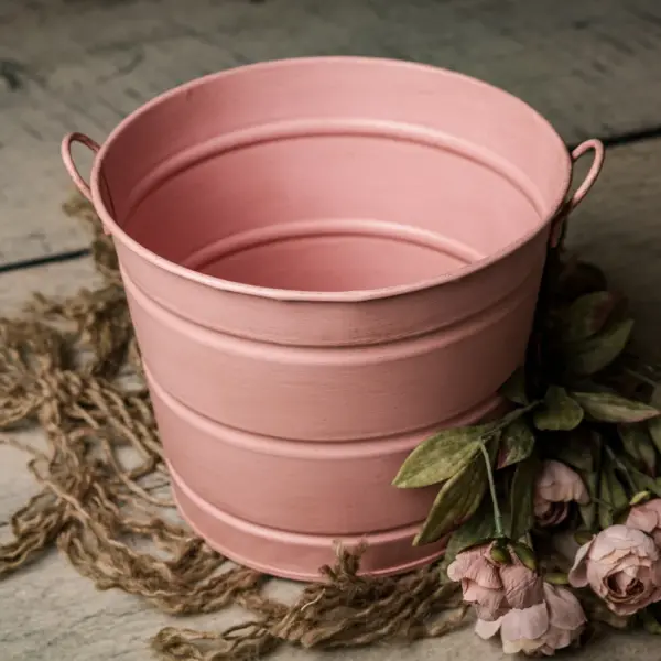 Peach orange newborn photography posing pail bucket