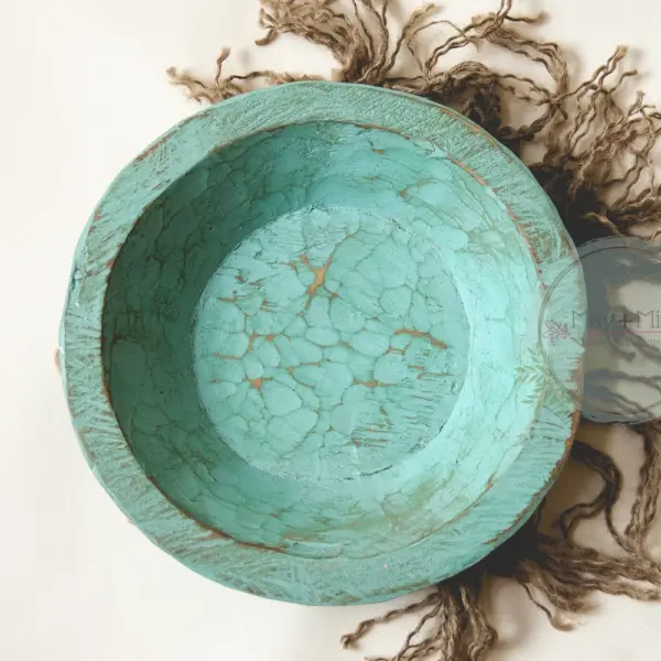 Shallow newborn photography posing bowl in soft green