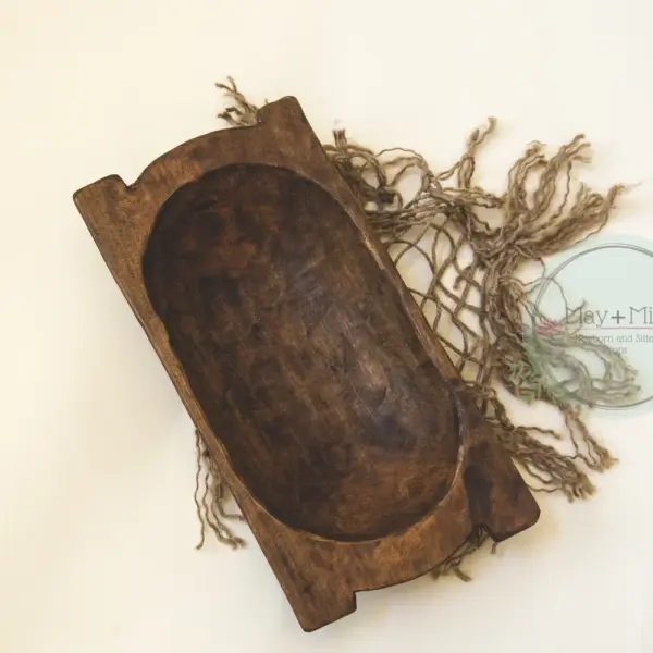 Natural wood trench newborn photography posing bowl