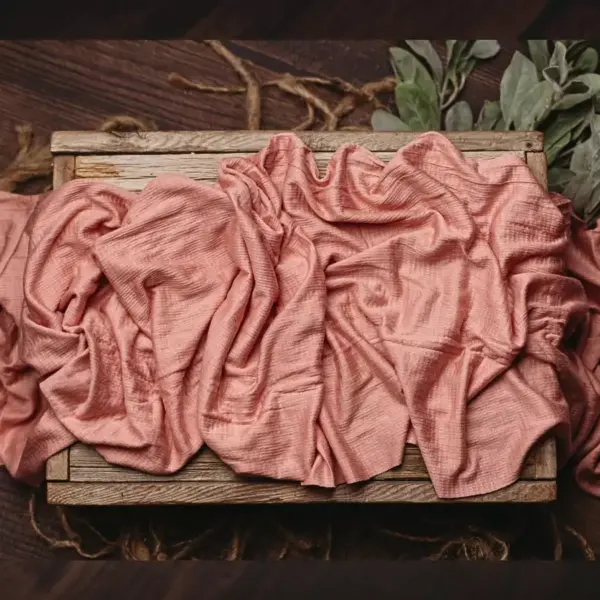 Newborn stretch wrap used for newborn photography wrapping and styling in pink